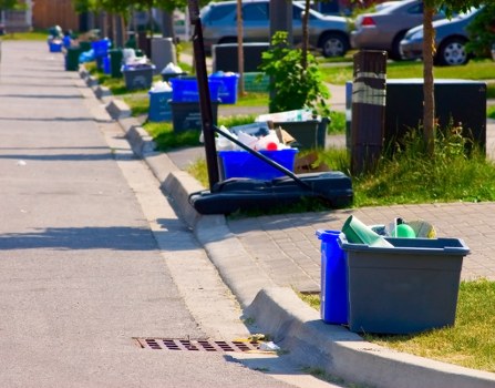 Environmentally friendly skip being placed in a residential area