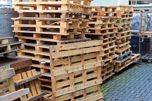 Various types of waste neatly loaded into an enclosed skip.